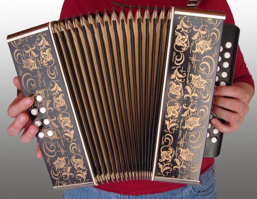 An accordion reed is contained within the bellows of an accordion.