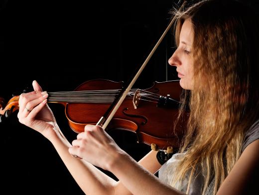 Classically trained musicians, including violinists, perform as part of the Trans-Siberian Orchestra.